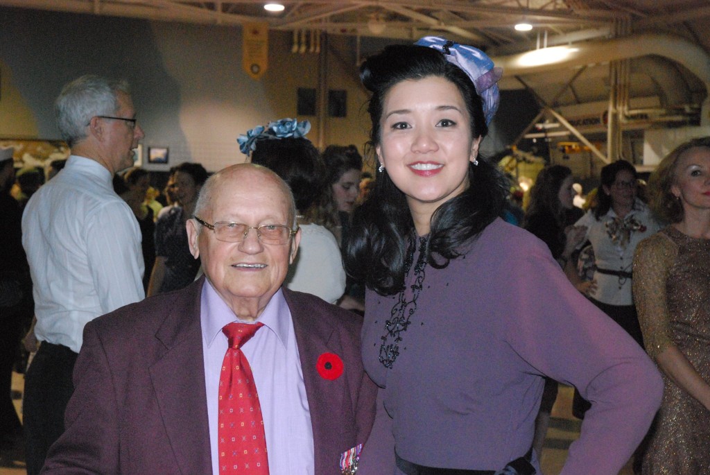 1940s Vintage Dresses at a 1940s dance as seen on the Toronto Vintage Society. Image features a member with a Canadian war veteran