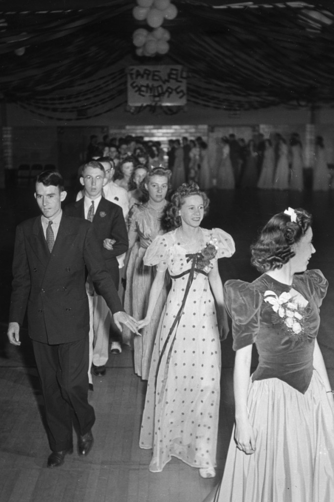 1940s Prom gowns on display as seen in a 1940s vintage photo of a 1940s prom / dance. 1940s Fashion / 1940s Vintage Image