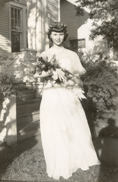 1950s young women going to prom vintage photo. Featuring a pretty 1950s dress and cute 1950s hairstyle. 