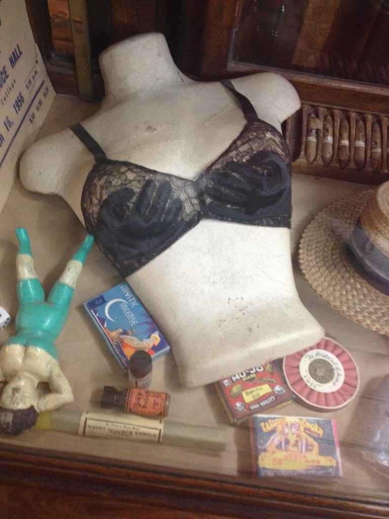 1930s / 1940s Vintage Bra as seen in A. Schwab Memphis. Surrealist late 30s to early 40s black lace over nude mesh bra with black silk satin
"hands" on cups.