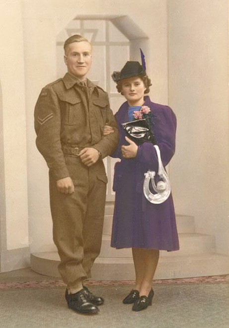 1940s vintage photo of a War Bride and her Solider-Coloured photo.  war bride Cathie Elliot to her very handsome Canadian Solider-Glen. They were married on Christmas Eve, 1940, Aberdeen, Scotland. As you can see she is not wearing a traditional white dress.