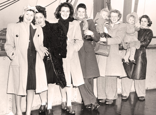 1940s Canadian War Brides Coming to their new home. 1940s Fashions on display-Coats, hair scarfs and kids. 