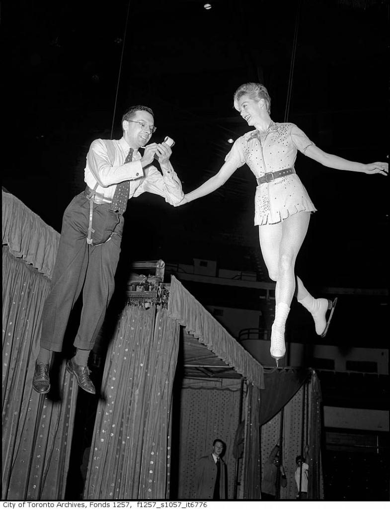 1950s Ice Capades Maple Leaf Gardens -Performer in Maple Leaf Gardens' Ice Capades rehearsing Peter Pan with journalist.