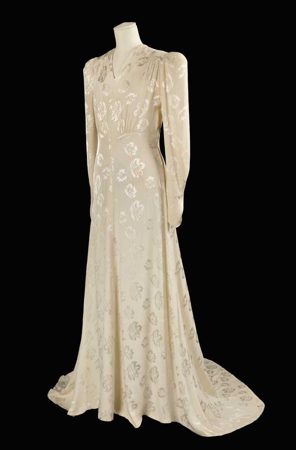 1940s wedding gown - The floor-skimming gown was made from floral-patterned pre-war silk, originally intended for making petticoats.

It was first worn by Evelyn Higginson when she married sailor Charles Butterfield on 18 September 1943. Read all about the other 14 women who wore the dress by clicking the image of the dress. 