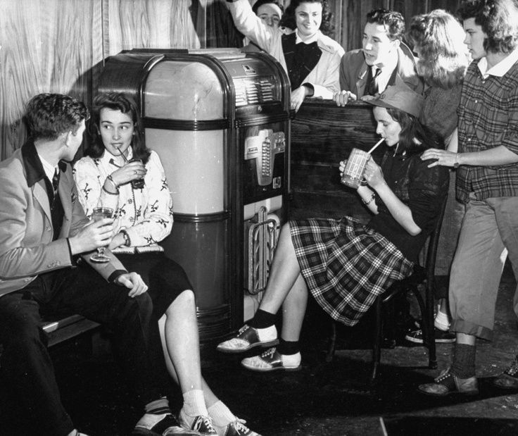 1940s teenagers listening to music at the soda shop