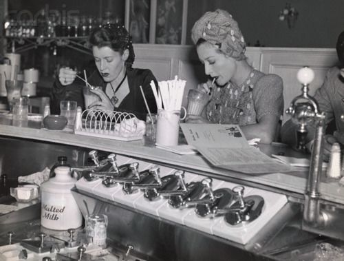 Joan Crawford at Soda Fountain with Editor Alice Thompson, 1939.