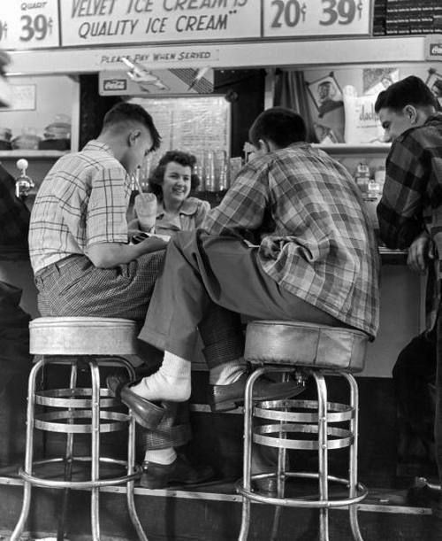 1950 teenage boys hanging at the soda shop