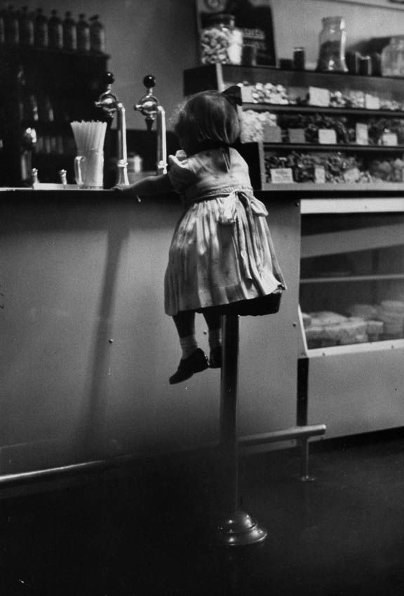 1950s little girl at the malt shop counter