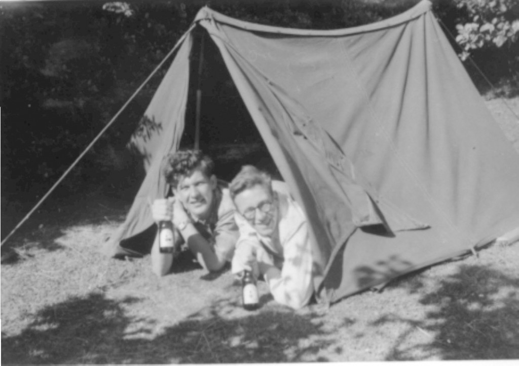 1950s Vintage Photo: Camping 1950s photo of a two men in a tent holding beers. 