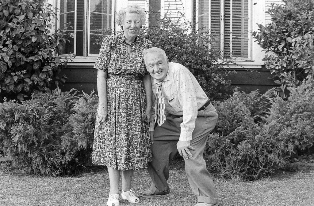 1950s Vintage Photo: Of an older couple posing together in 1950s fashions and having fun. 