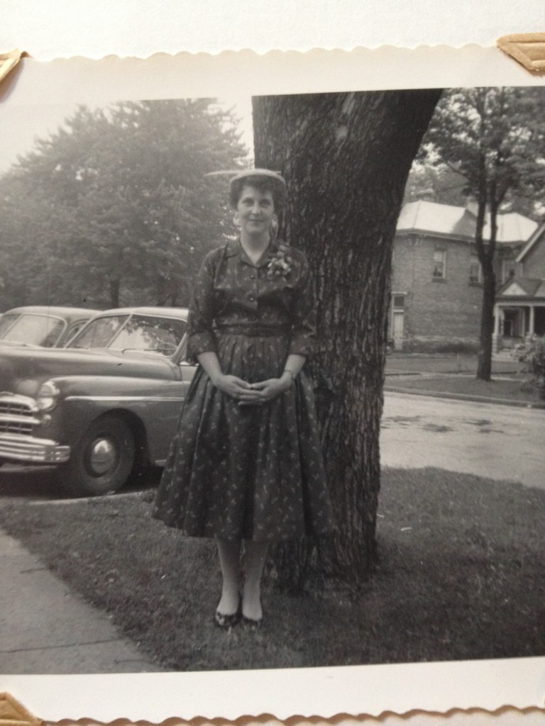 1950s vintage photo of the Vintage Inn Blog's Grandmother, Elizabeth in a Dior New Look style dress posing for a photo in London, Ontario, Canada.