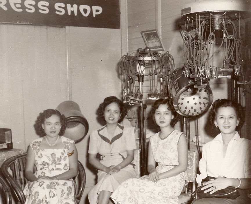 1940s Vintage Photo of Women in 1940s fashions sitting in a hair salon. 