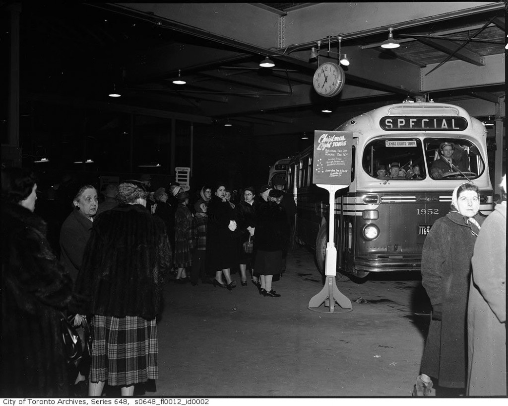 1950s vintage photo Toronto christmas lights tour featuring a 1950s bus taking people to look at lights. 