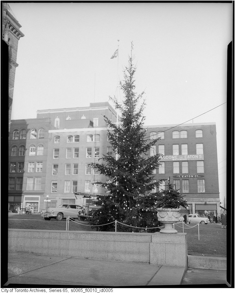 1950s vintage photo: City Hall Christmas Tree in the 1950s (now called 'Old City Hall'). Residents of Toronto will notice the 'Eaton store' in the background