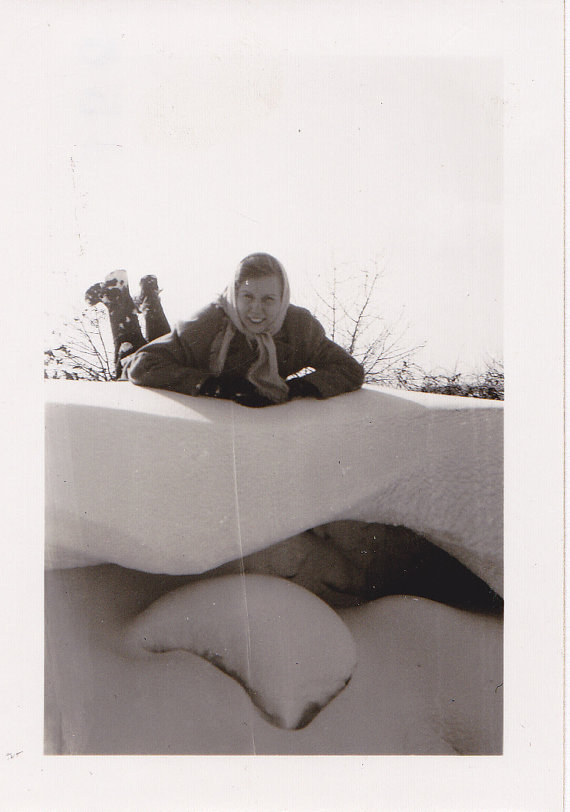 1940s vintage image of a woman on a snowdrift