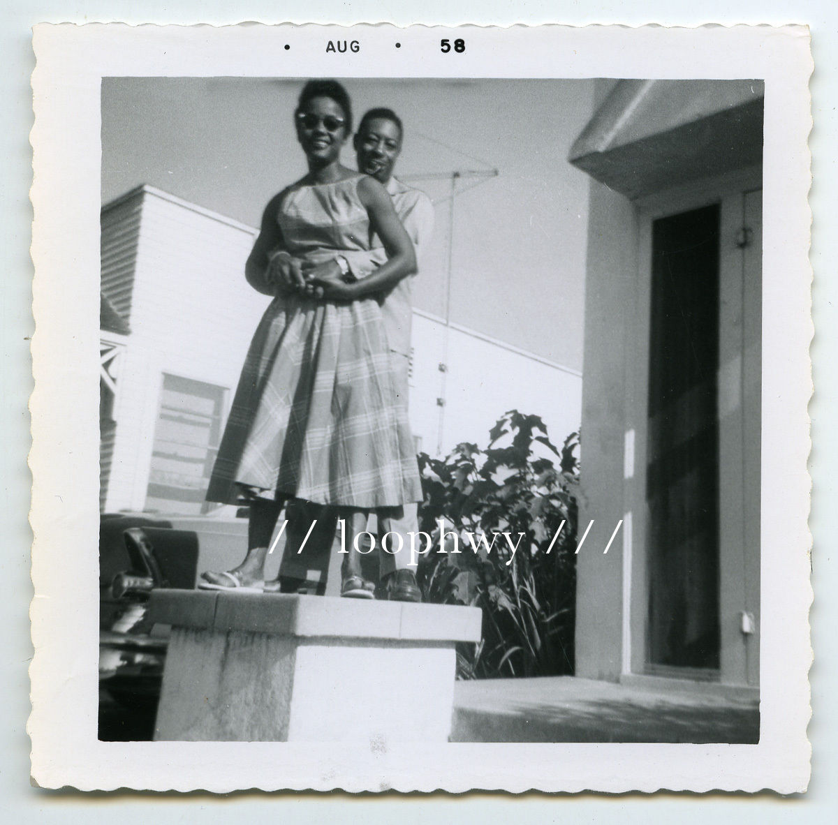 1950s Vintage Photo of a lovely Black Couple holding each and posing for a picture in August 1958. Great Summer Style! 