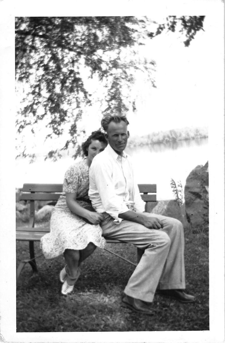 1940s Vintage Photo of a couple holding each other in a park. 