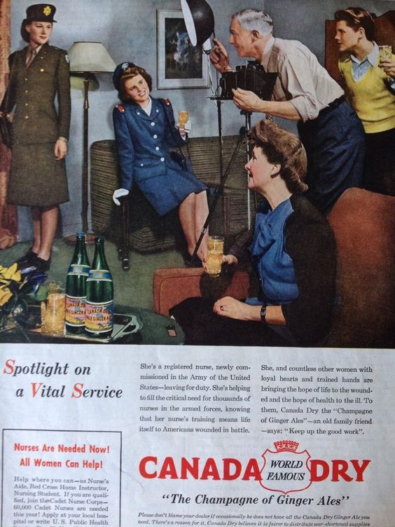 1940s Vintage ad for Canada Dry Ginger Ale. "Keep up the good work". Featuring an image of a dad ttaking a photo of his daughters in their miltary uniform. 