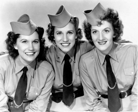 1940s vintage photo of Big Band Singers the Andrew Sisters in uniform.