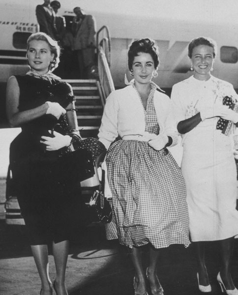 1950s vintage photo of Grace Kelly, Elizabeth Taylor, and Laraine Day "Flying in High Style," 1954.