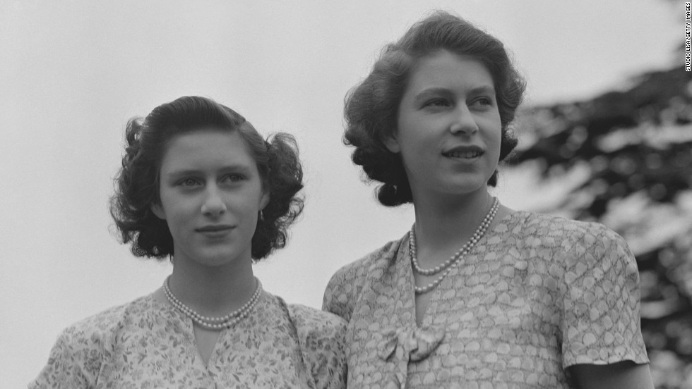 1940s photo: Queen Elizabeth II and Princess Margaret wearing summer dresses, circa 1942.