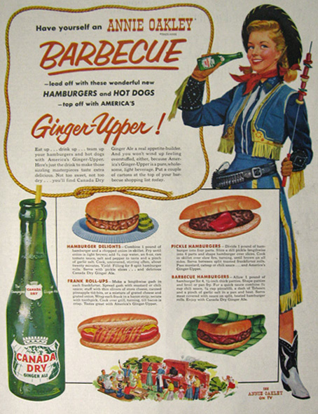 Original vintage magazine ad for Canada Dry Ginger Ale featuring Annie Oakley and BBQ recipes. 