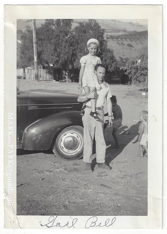 1940s vintage photo of father with kids