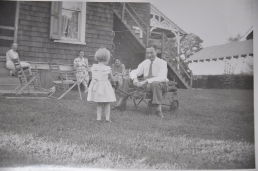 Lovely family photograph with a little girl and her daddy, circa 1940's/1950's vintage photo. 