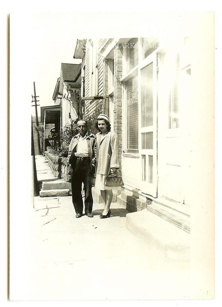 1940s father with his daughter in a 1940s joke and 1940s purse. 