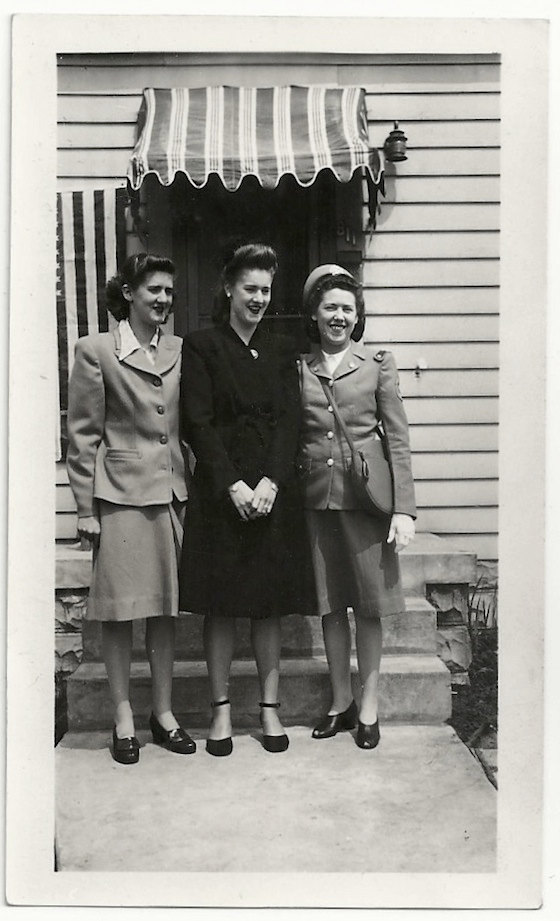 1940s vintage photo of 3 women, 1 in uniform and three fantastic 1940s hairstyles. 