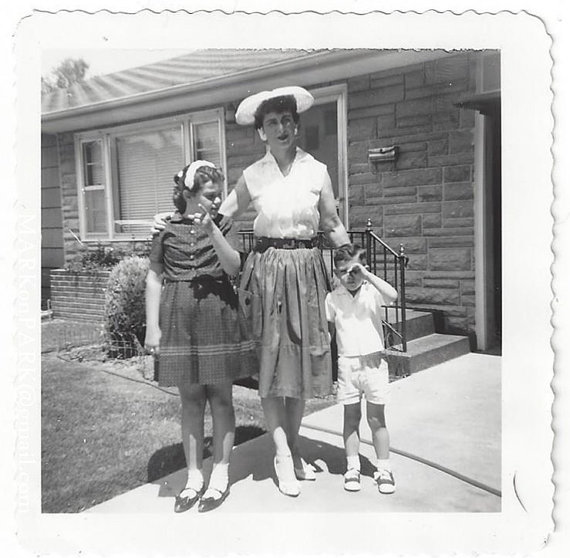 1961 vintage family image featuring early 1960s fashions. 