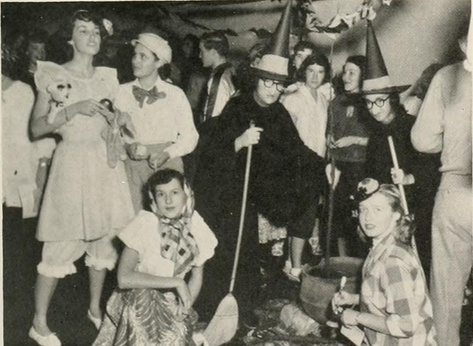 1950s vintage photo of a Halloween party at Mars Hill College, 1951 featuring young college women in Halloween costumes. 