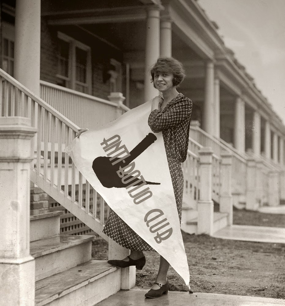 1920s vintage photo of a young woman posing with a bar called "the Anti-Flirt" Club. She is wearing 1920s dress and 1920s hairstyle. 