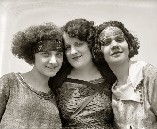 1920s vintage photo of three young flappers with bobbed hair. Fun 1920s fashions and 1920s hairstyles. 