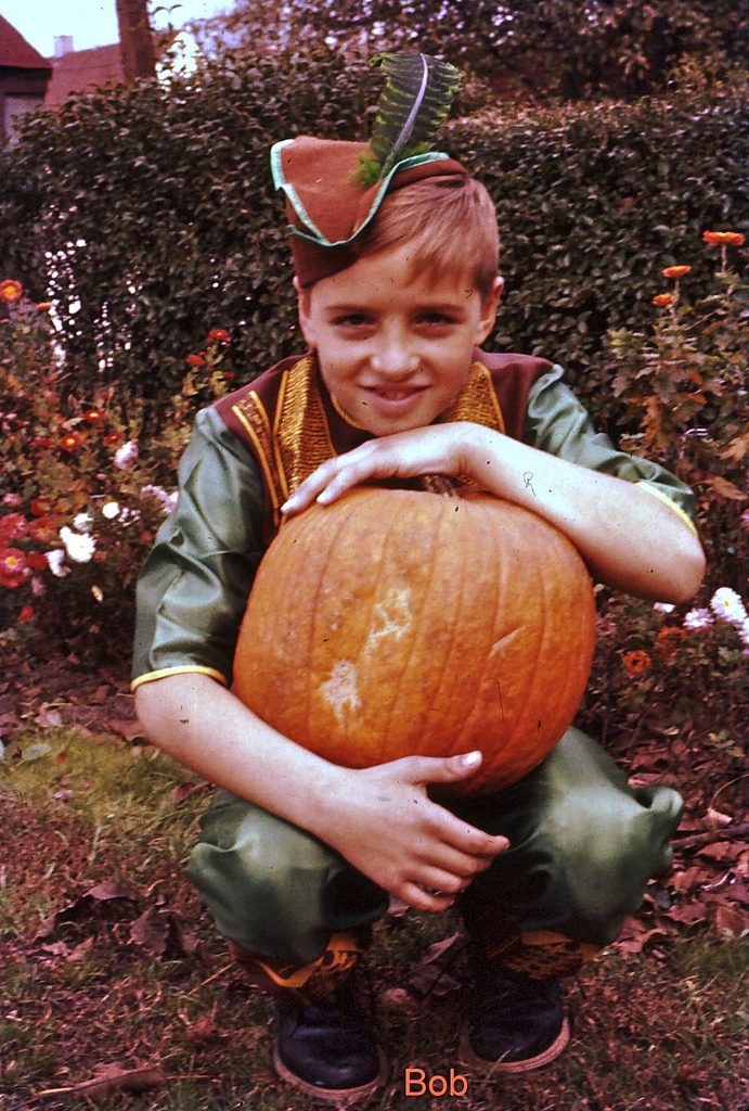 1950s Halloween Image of a Boy dressed as Robin Hood in 1957. Vintage Halloween costume idea. 