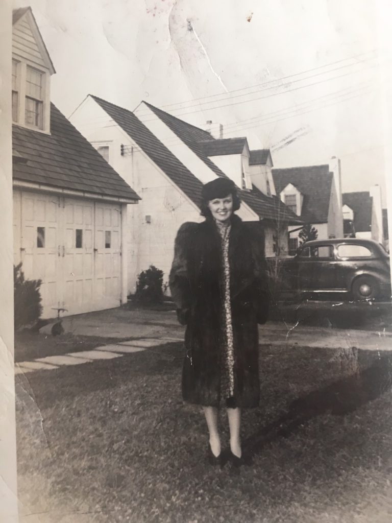 1940s-vintage-image-of-women-on-front-lawn-in-fur-coat