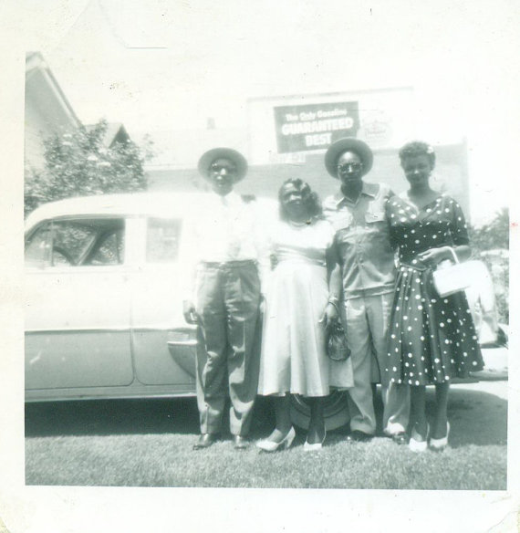 1950s Vintage Photo of 2 Black Couples all dressed up in 1950s Fashions in front of a car. 