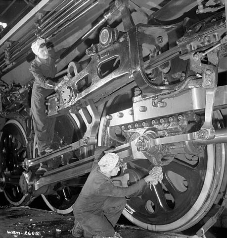 1940s vintage photo of Canadian Women during WW2 working on trains for the Homefront War Effort. 