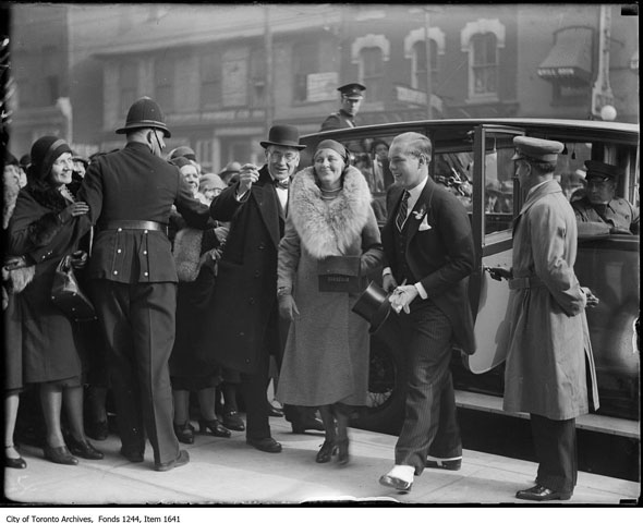 1930s Photo: Here is John David Eaton and Lady Eaton, his mother, arrive at the opening ceremony for the company's College St. store. They are wearing 1930s fashions