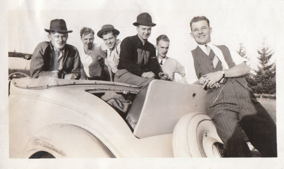 1930s vintage image of men with their car in 1930s fashions. 1930s College Men.