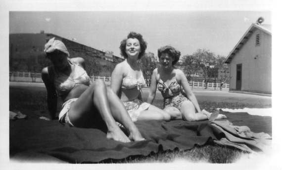 1940s vintage image of women sunbathing in 1940s swimsuits