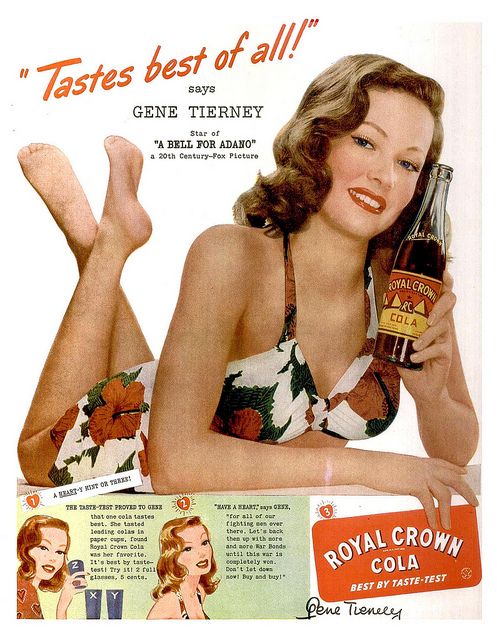 1940s vintage ad for Royal Crown Cola featuring Gene Tierney in a 1940s swimsuit holding an RC Cola. 