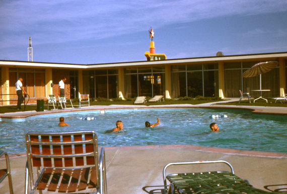 1960s vintage holiday inn family photo by the pool