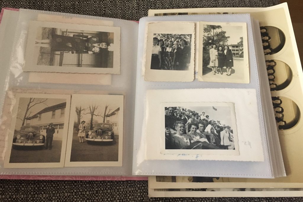 Collection of vintage photos from the 1920s to the 1960s in a photo album. 