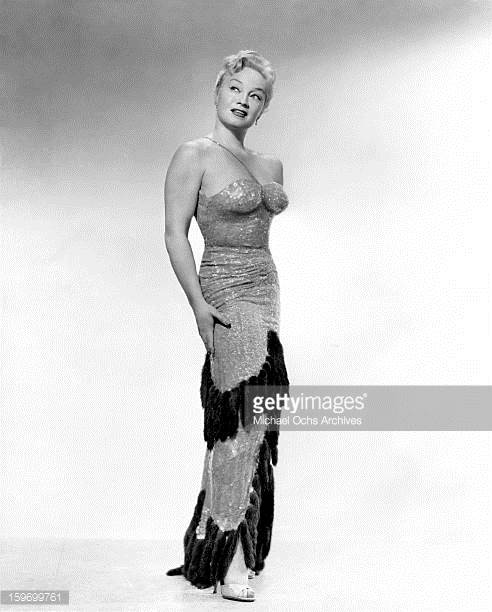 Vintage Photo of All feamle swing band leader Ina Ray Hutton in a sequined evening gown. 