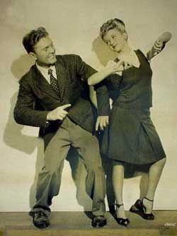 1940s vintage photo of swing dancers Chuck Saggau & Jean Veloz dancing together for a movie in 1940s fashions. 