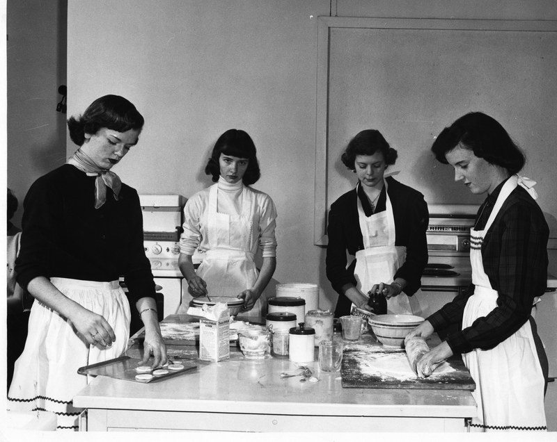 1950s vintage photo: University of Nashville Photograph of four female students in action during a home economics class 1950s