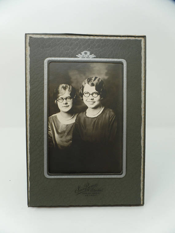 1927 vintage image of two young women wearing glasses