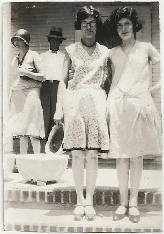 1920s vintage photo of stylish young women in 1920s dresses and 1920s hairstyles. 