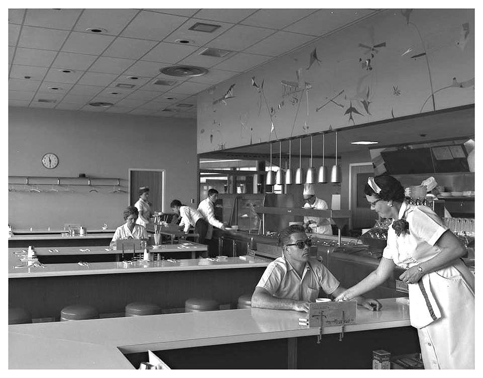 Restaurant at Ottawa, Canada Uplands Airport 1960. The vintage 1960s image features a diner with waitress and guests in 1960s fashions. 